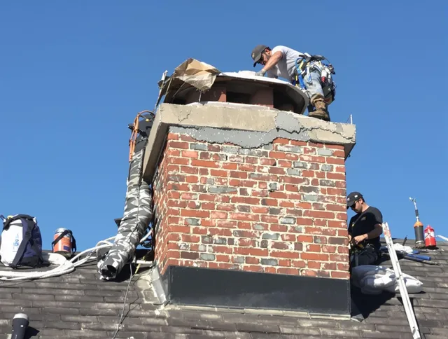 Hanover Chimney Sweep installing a custom chimney crown in Hanover, MA