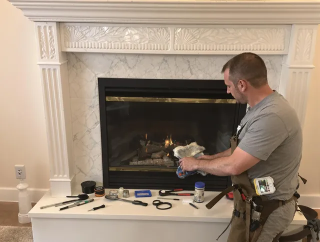 Hanover Chimney Sweep performing fireplace maintenance in Hanover, MA