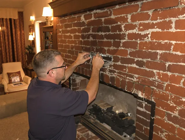 Hanover Chimney Sweep expert fixing a fireplace in Hanover, MA